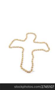 crucifix with a pearl necklace isolated on a white background