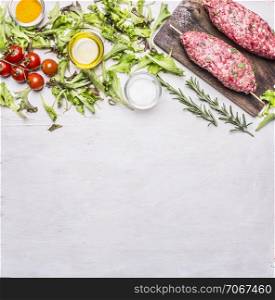 Crude kebab on a skewer with vegetables on a cutting board border ,place for text on wooden rustic background top view close up
