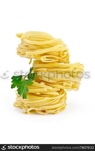 Crude twisted noodles with parsley isolated on white background