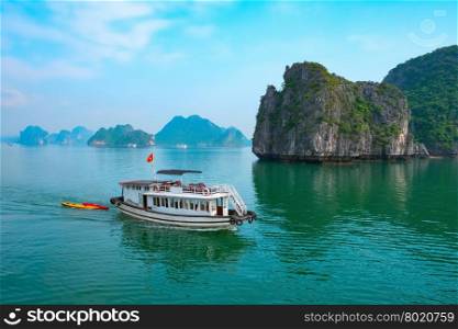 Cruise boat near rock islands in Halong Bay, Vietnam, Southeast Asia