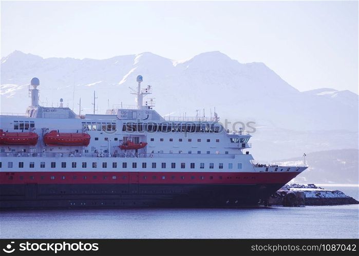 cruise service vessel and mountains on the background. Norway.
