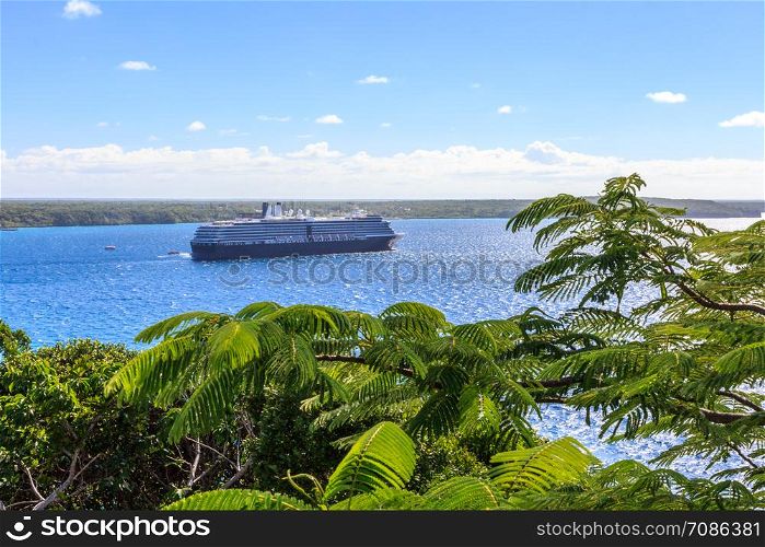 Cruise ship anchored in a bay, Lifou, New Caledonia,