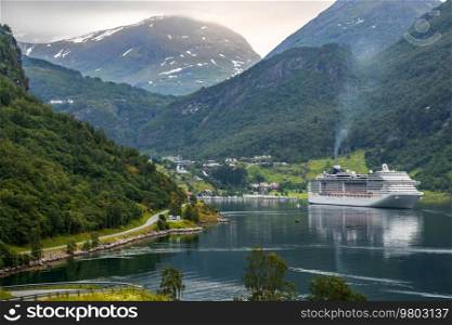Cruise Ship, Cruise Liners On Geiranger fjord, Norway. The fjord is one of Norway’s most visited tourist sites. Geiranger Fjord, a UNESCO World Heritage Site