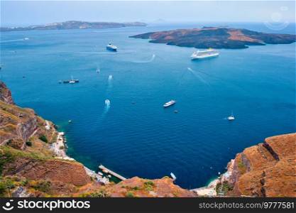 Cruise ships and tourist boats in sea. Greek isaldn Santorini, Greece. Cruise ships and tourist boats in sea