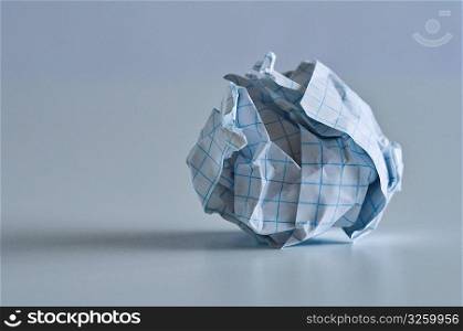 Crumpled ball of grid paper.