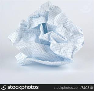 crumpled blank white sheet of paper into the cell from a school notebook, white background