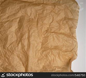 crumpled brown baking parchment paper, full frame