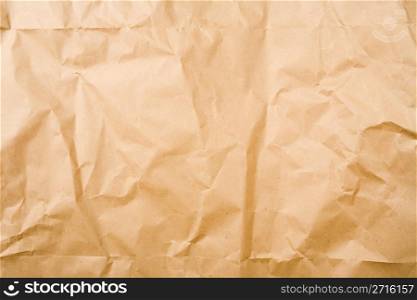 Crumpled brown packaging paper sheet texture background