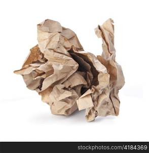 Crumpled brown paper isolated on white with natural shadows
