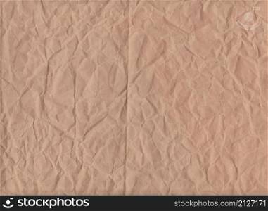 Crumpled brown paper of texture background for design in your work.