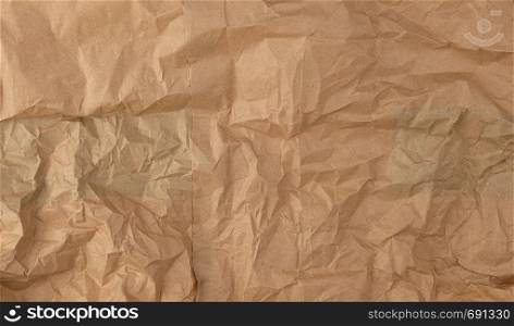 crumpled brown sheet of paper, full frame, close up
