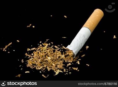 Crumpled cigarette and tabaco