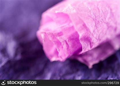 Crumpled multi-colored real colorful paper sheets texture backdrop. Close up. Shallow depth of field. Toned.. Multi-colored crumpled real vivid paper sheets texture background. Close up. Shallow depth of field.