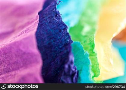 Crumpled multi-colored real colorful paper sheets texture backdrop. Close up. Shallow depth of field. Toned.. Multi-colored crumpled real vivid paper sheets texture background. Close up. Shallow depth of field.