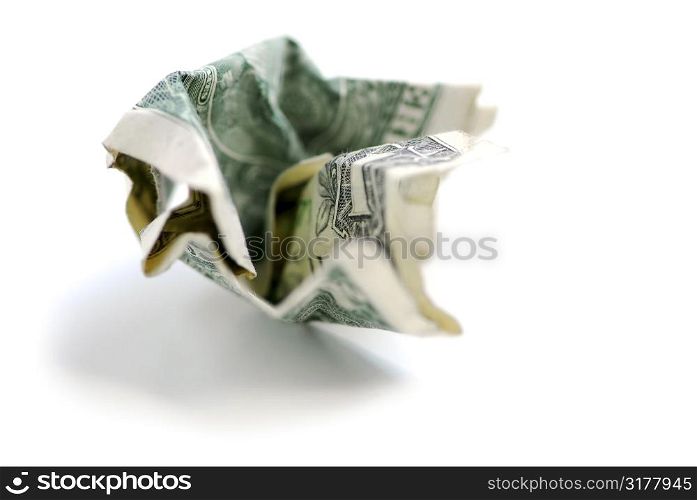 Crumpled one us dollar bill