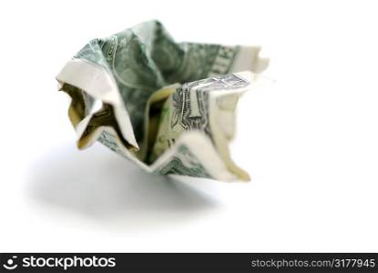 Crumpled one us dollar bill