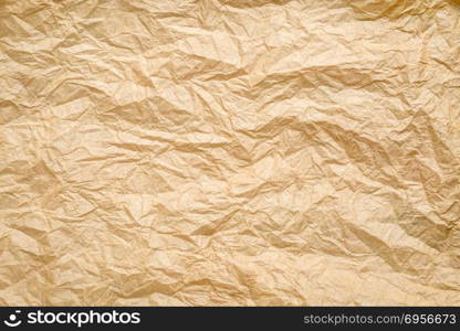 crumpled paper background. crumpled, wrinkled and creased brown paper background