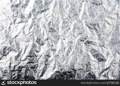 Crumpled plastic coated aluminum foil background texture