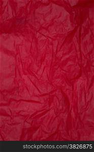 Crumpled red paper with texture background.