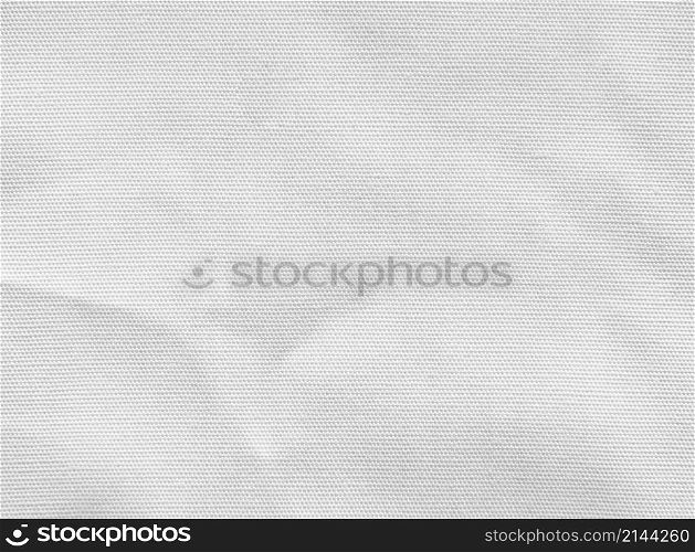 Crumpled white cotton fabric texture background