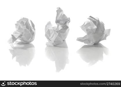 Crumpled white papers with reflections