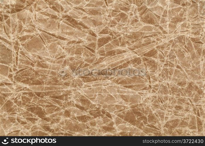 crumpled, wrinkled and creased brown wax paper background
