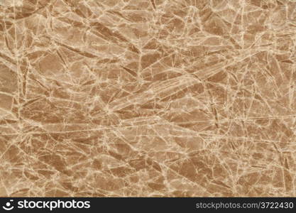 crumpled, wrinkled and creased brown wax paper background