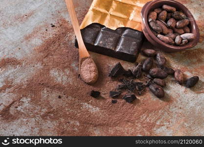 crushed broken chocolate cocoa beans bowl rustic backdrop