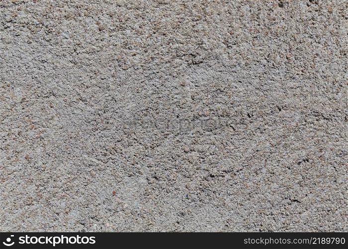 Crushed granite stones wall - close up background. Crushed granite stones wall - close up