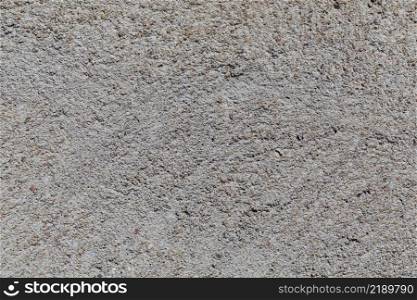 Crushed granite stones wall - close up background. Crushed granite stones wall - close up