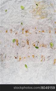 Crushed greasy paper background with thyme leaves