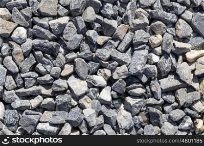 Crushed grey stone on the ground texture background