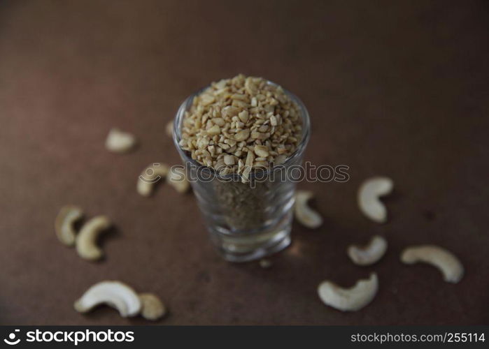 crushed peanuts on wood background in mystic light