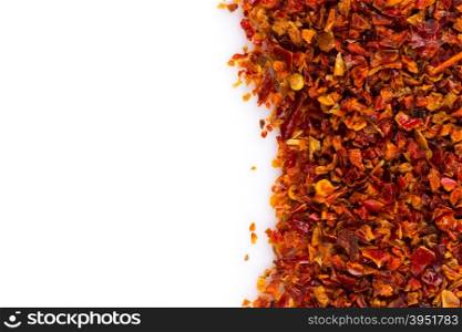 Crushed red chili pepper on white background