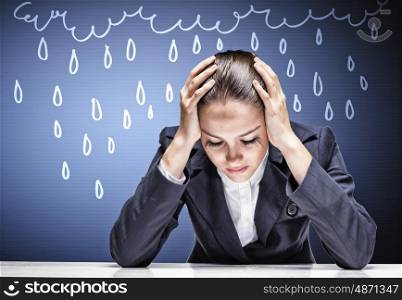 Crying businesswoman. Troubled crying businesswoman with hands on head