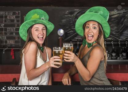 crying happy women saint patricks hats clanging glasses drink bar counter