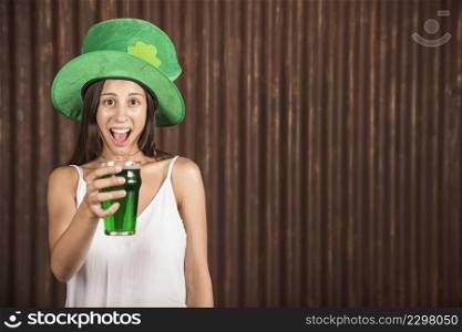 crying young woman showing glass drink