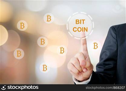 Cryptocurrency and Bitcoin concept, Businessman hand touch bitcoin icon over blur background, banner