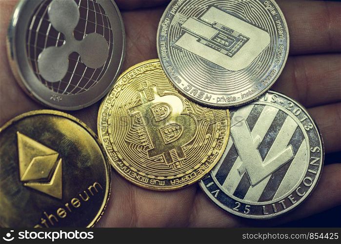Cryptocurrency coins - Litecoin, Bitcoin, Ethereum, virtual money close-up. Cryptocurrency coins - Litecoin, Bitcoin, Ethereum, virtual money