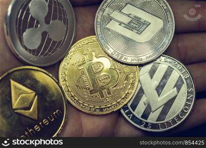 Cryptocurrency coins - Litecoin, Bitcoin, Ethereum, virtual money close-up. Cryptocurrency coins - Litecoin, Bitcoin, Ethereum, virtual money