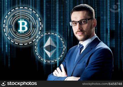 cryptocurrency, financial technology and business concept - businessman with ethereum and bitcoin holograms over binary code background. businessman with cryptocurrency holograms