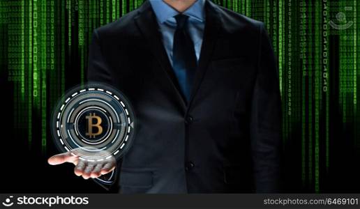 cryptocurrency, financial technology and business concept - close up of businessman with virtual bitcoin symbol hologram over and binary code and black background. close up of businessman with bitcoin hologram