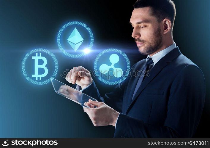 cryptocurrency, financial technology and business concept - close up of businessman with transparent tablet pc computer and virtual bitcoin, ethereum and ripple holograms over dark background. businessman with tablet pc and cryptocurrency. businessman with tablet pc and cryptocurrency