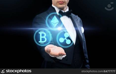 cryptocurrency, financial technology and business concept - man in tailcoat with virtual bitcoin, ethereum and ripple icons over black background. man in tailcoat with cryptocurrency holograms. man in tailcoat with cryptocurrency holograms