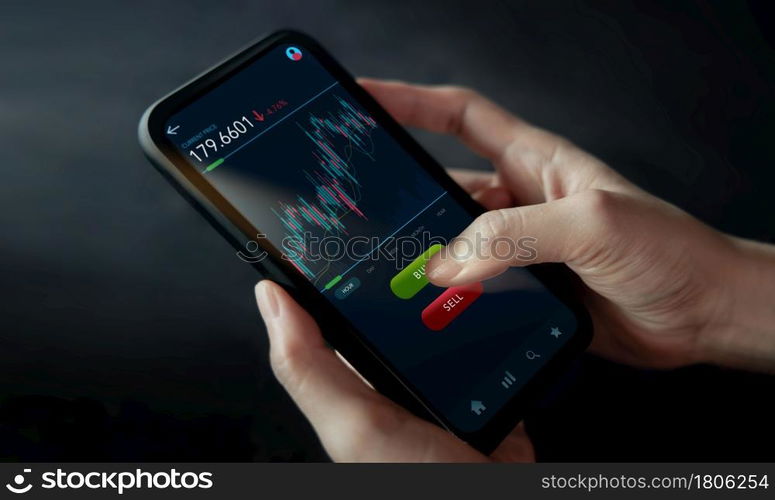 Cryptocurrency Investment Concept. Person Using Mobile Phone to Buy and Sell Bitcoin via Online Exchange Platform. Blockchain,Fintech Technology. Innovation of Financial Investment. Closeup shot