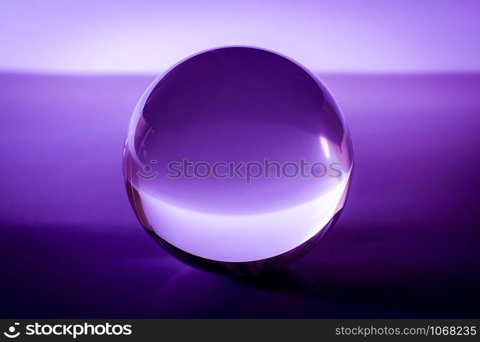 Crystal ball in abstract purple