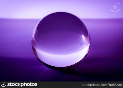 Crystal ball in abstract purple