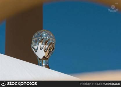 Crystal Ball representing Hand Holding the Sphere