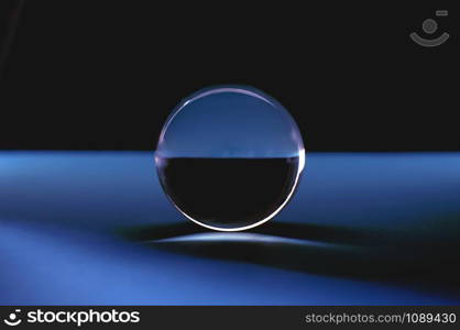 Crystal ball with reflections in blue