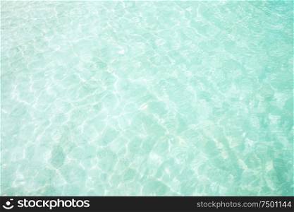 Crystal clear and turquoise sea water of the tropical sea .